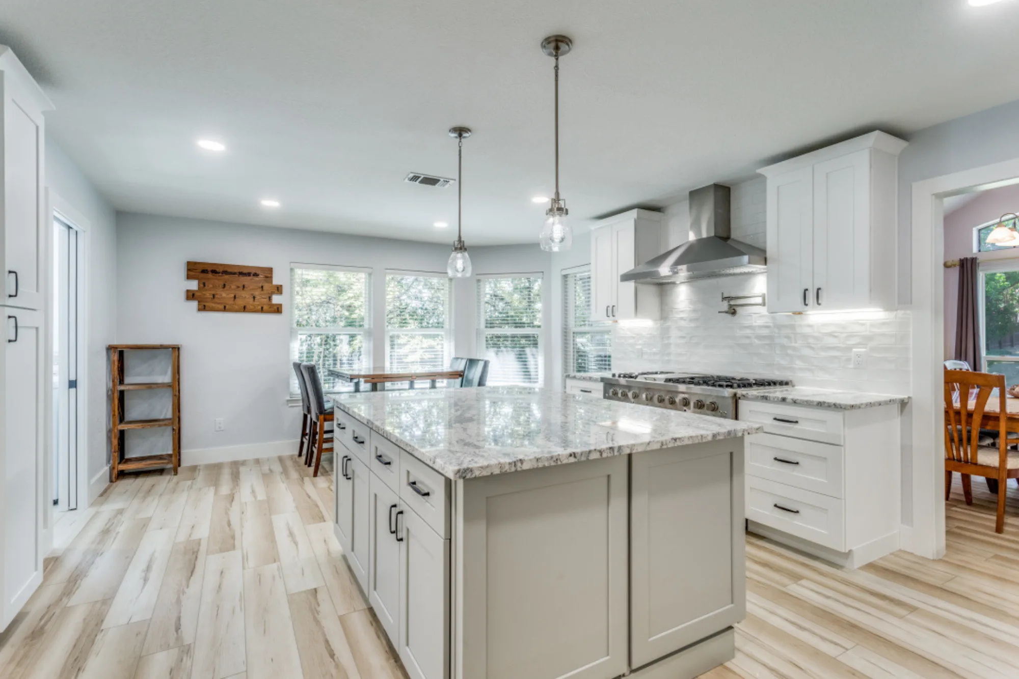 Custom kitchen island with granite waterfall edge and bar seating