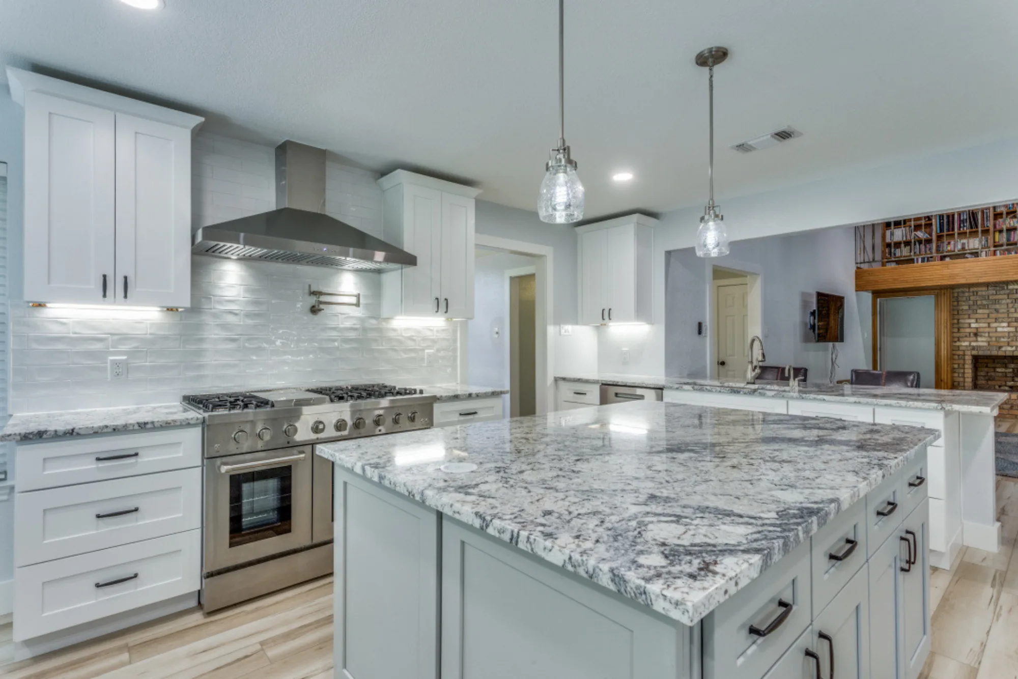Detail of granite countertop and under-cabinet lighting in remodeled kitchen